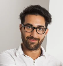 Young dark-haired man wearing contemporary men’s eyeglasses