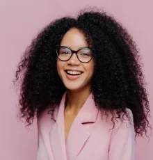 Young African woman smiling while wearing stylish eyeglasses